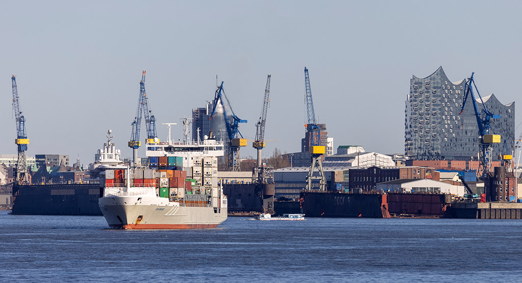 BERLIN:  In this file photo taken on March 07, 2022 container ship Dagmar leaves the harbor of Hamburg on the river Elbe, while the building of the Elbphilharmonie concert hall (right) is seen in the background, in Hamburg, northern Germany.— AFP