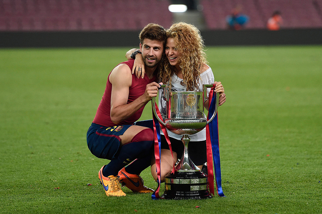 In this file photo Barcelona’s defender Gerard Pique (left) and his wife Colombian singer Shakira pose with the trophy at the end of the Spanish Copa del Rey (King’s Cup) final football match Athletic Club Bilbao vs FC Barcelona at the Camp Nou stadium in Barcelona.— AFP