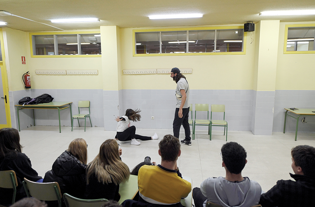 Spanish actors Ana Merchante (left) and Manu Chacon play a scene during interactive theatre by El Teatro Que Cura (The Healing Theatre) to raise awareness about domestic violence among teens, at El Olivo high school in Parla, south of Madrid.- AFP photos