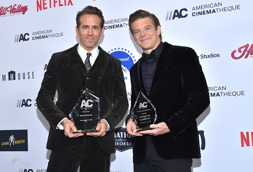 CEO of Blumhouse Productions Jason Blum (right), with his award for the 2022 Power of Cinema, poses next to Canadian-US actor Ryan Reynolds holding his Annual American Cinematheque Award during the 36th Annual American Cinematheque Award Ceremony at the Beverly Hilton Hotel in Beverly Hills, California.- AFP photos