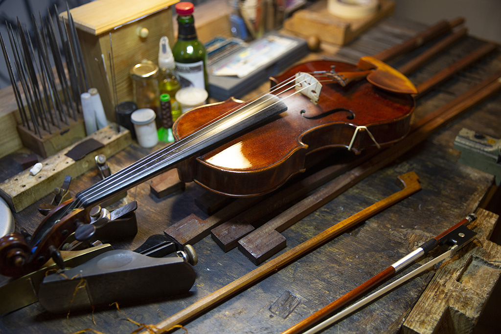 This file photo shows a violin and bows at the studio of French bow maker Edwin Clement in Paris. — AFP photos