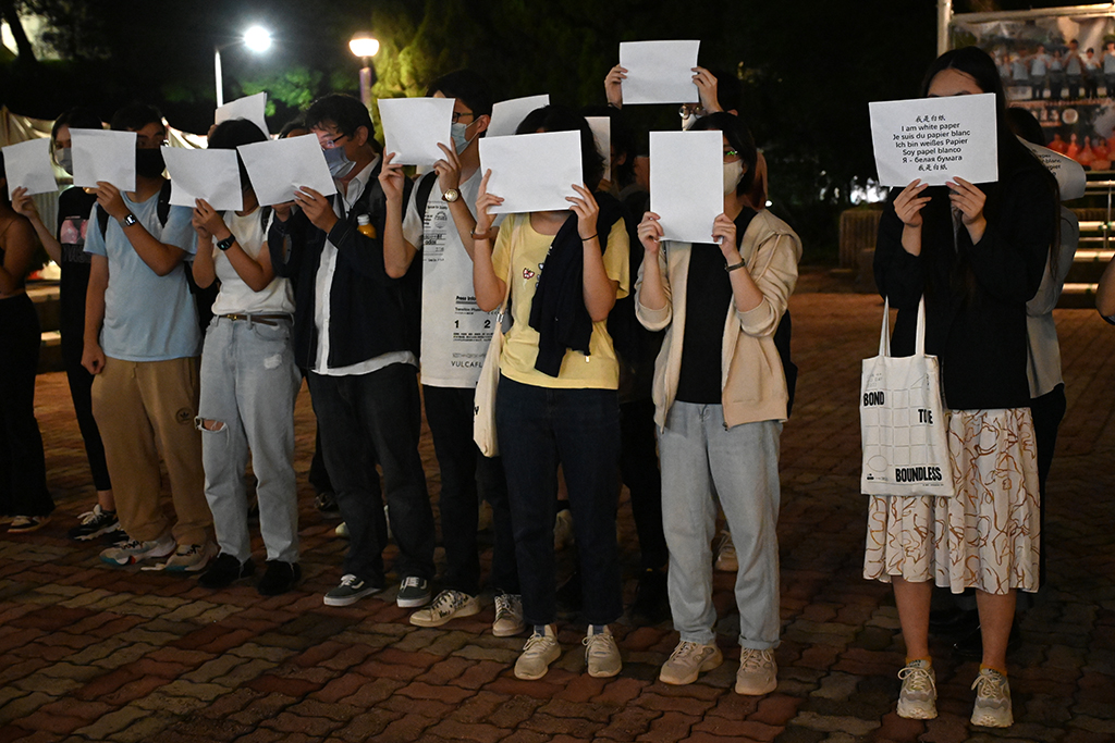 Students hold up placards including blank white sheets of paper on the campus of the Chinese University of Hong Kong, in solidarity with protests held on the mainland over Beijing’s COVID-19 restrictions.— AFP photos