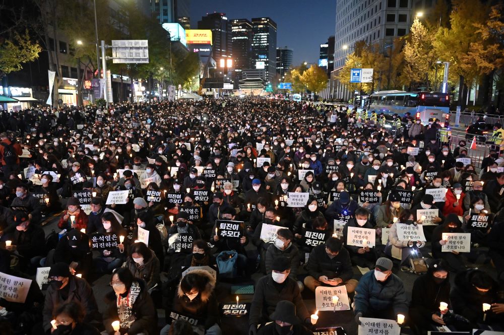 Seoul: People take part in a candlelight vigil to commemorate the 156 people killed in the October 29 Halloween crowd crush, in Seoul on November 5, 2022. - AFP