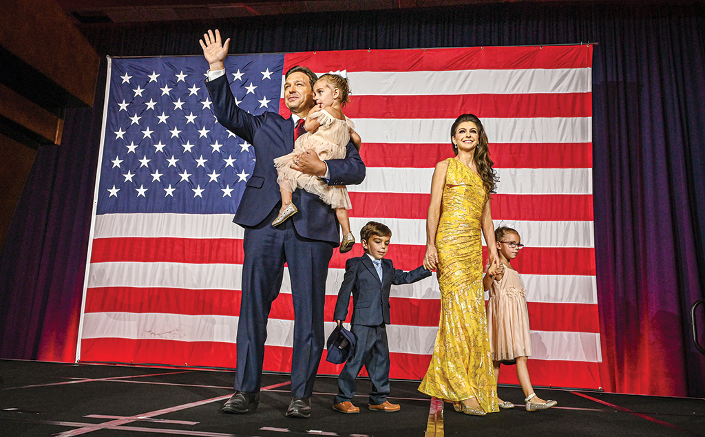 TAMPA, United States: Republican gubernatorial candidate for Florida Ron DeSantis with his wife Casey DeSantis and children Madison, Mason and Mamie, waves to the crowd during an election night watch party at the Convention Center in Tampa, Florida. - AFP