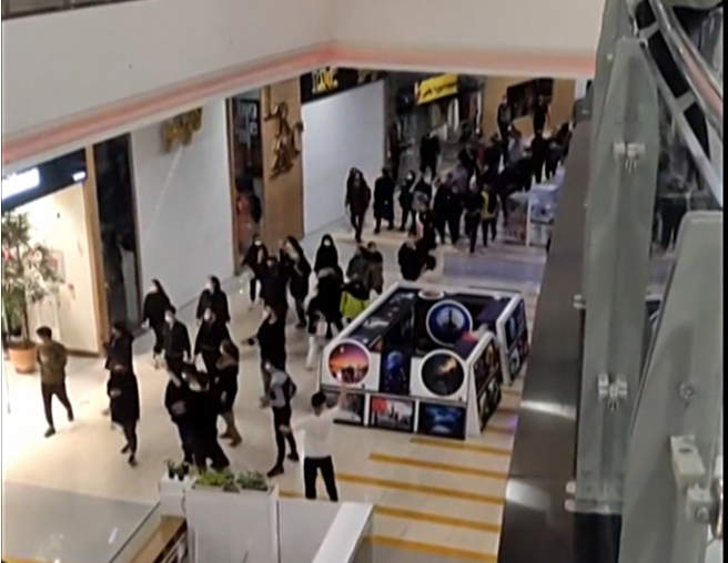 ISFAHAN, Iran: This image grab from a UGC video posted on November 15, 2022, reportedly shows Iranian demonstrators walking through a shopping mall and shouting slogans in support of the protest movement in the heart of Iran's central city of Isfahan. - AFP