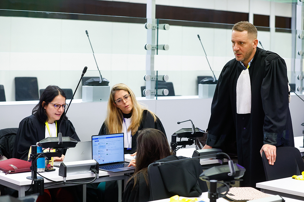 BRUSSELS: Salah Abdeslam's Lawyer Delphine Paci (L) speaks with Defense lawyer Virginie Taelnan (C) and Stanislas Eskenazi, lawyer of Mohamed Abrini, at the opening of the trial against the nine alleged jihadists accused of taking part in the March 2016 suicide bombings, at the Justitia building in Brussels on November 30, 2022. – AFP