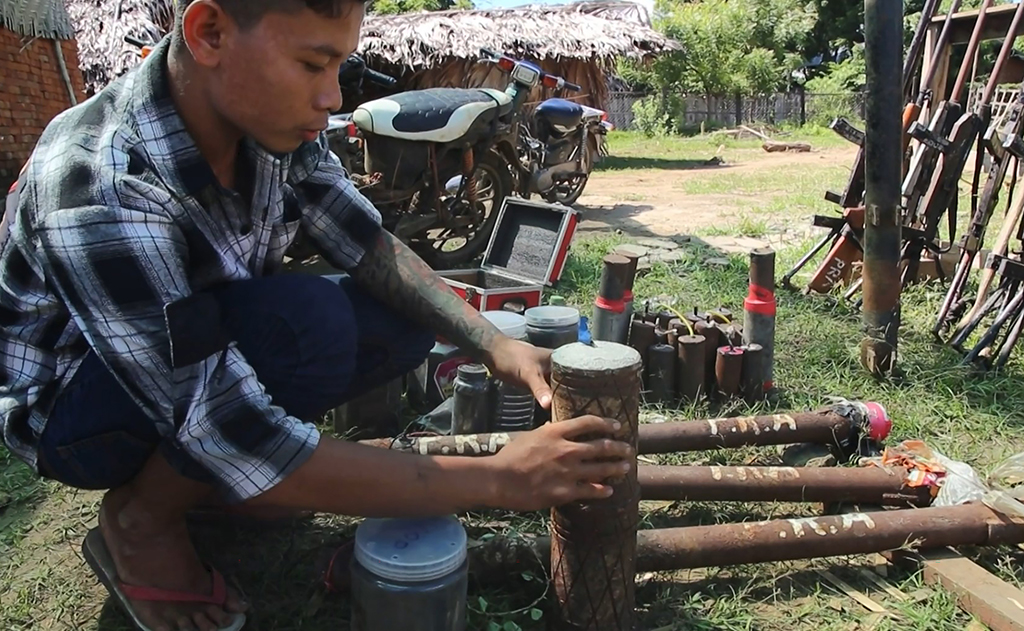 PALE: This screengrab from AFPTV video footage taken on October 15, 2022 shows members of the People Revolution Army (PRA) preparing homemade weapons in Pale township.— AFP