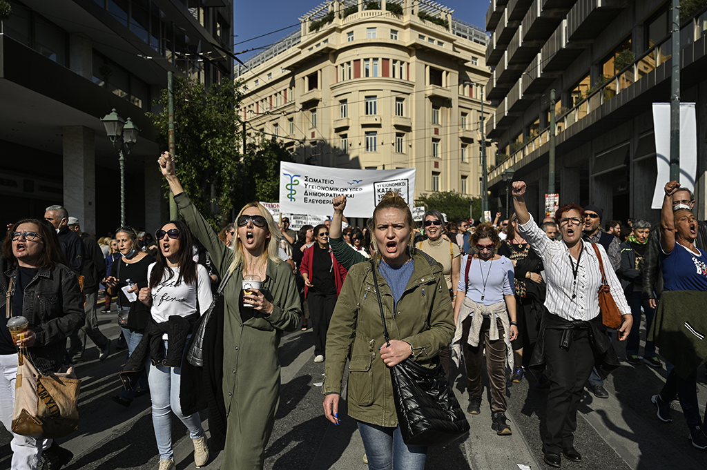 ATHENS: Health workers hold banners and shout slogans as they demonstrate over price hikes and spiraling inflation, in Athens, on November 9, 2022.— AFP