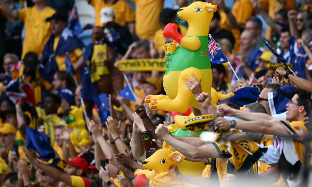 A fan of Australia holds a kangaroo as he celebrate after the team defeated Tunisia 1-0 in the Qatar 2022 World Cup