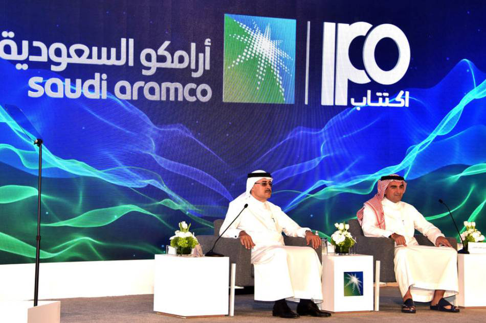 President and CEO of Saudi Aramco Amin Nasser (left) and Aramco chairman Yasir Al-Rumayyan attend a press conference to announce an initial public offering of the state oil producer, in Dhahran, Saudi Arabia  in this 03 November 2019 file photo.