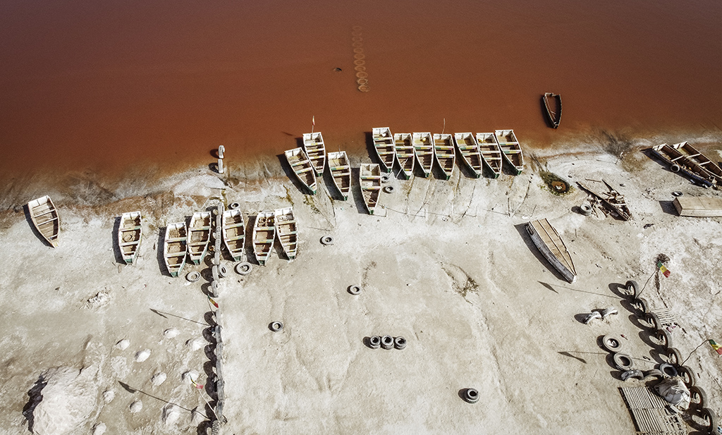 This aerial view shows rows of boats used for harvesting salt in Lake Retba (Pink Lake) in Senegal. – AFP photos