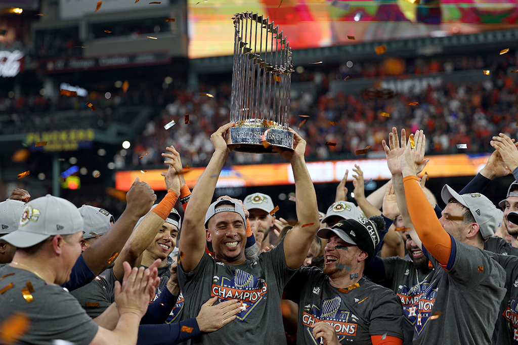 HOUSTON: Michael Brantley #23 of the Houston Astros celebrates with the Commissioner’s Trophy after defeating the Philadelphia Phillies 4-1 in Game Six of the 2022 World Series on November 05, 2022.- AFP