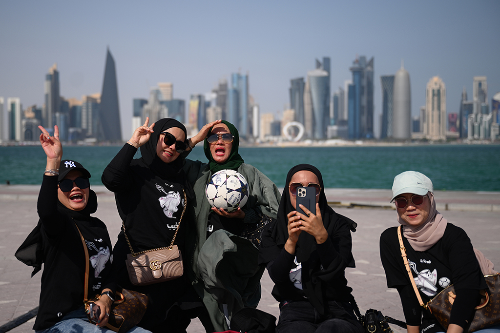 DOHA: Fans from Indonesia pose for a selfie near the waterfront in Doha, ahead of the Qatar 2022 World Cup football tournament. – AFP