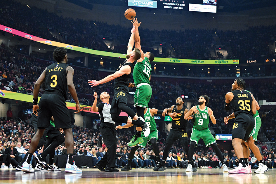 CLEVELAND: Dean Wade #32 of the Cleveland Cavaliers and Grant Williams #12 of the Boston Celtics jump for the ball during the second quarter at Rocket Mortgage Fieldhouse on November 02, 2022.- AFP