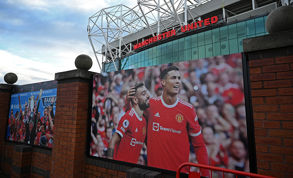 MANCHESTER: A poster shows an image of Ronaldo outside of Old Trafford stadium, the home ground of Manchester United football team, in Manchester, northern England.- AFP
