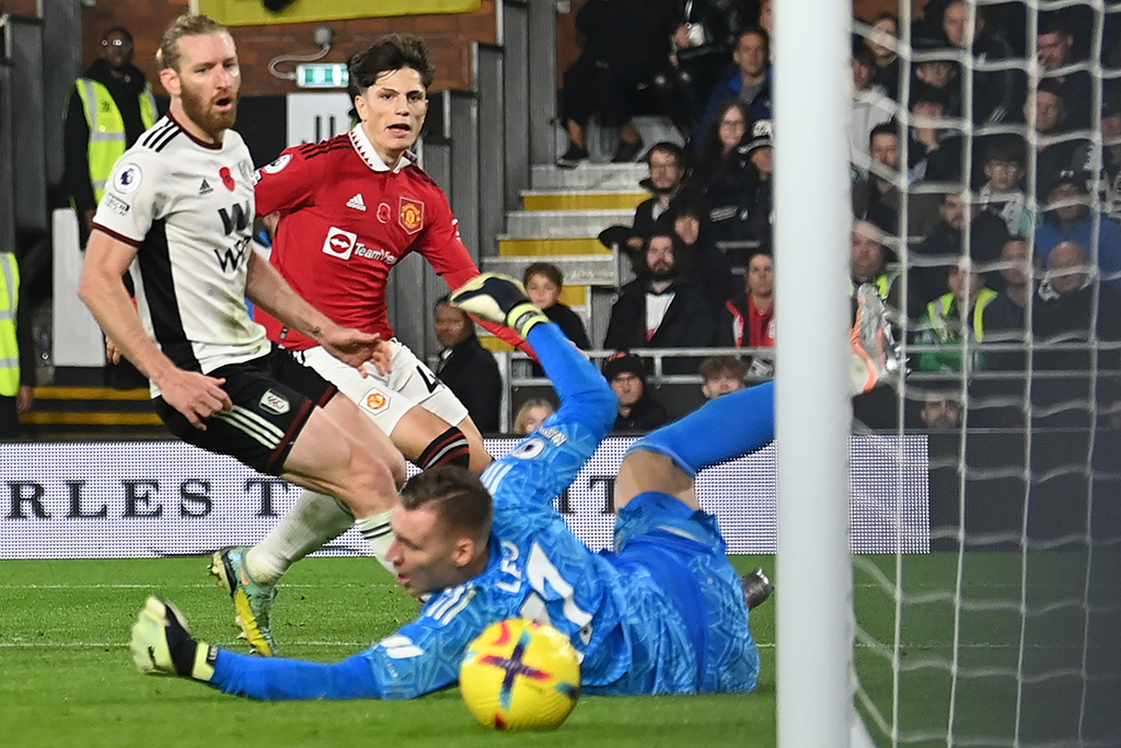 LONDON: Manchester United's Argentinean midfielder Alejandro Garnacho (2nd left) scores his team's second goal past Fulham's German goalkeeper Bernd Leno during the English Premier League football match on November 13, 2022. - AFP