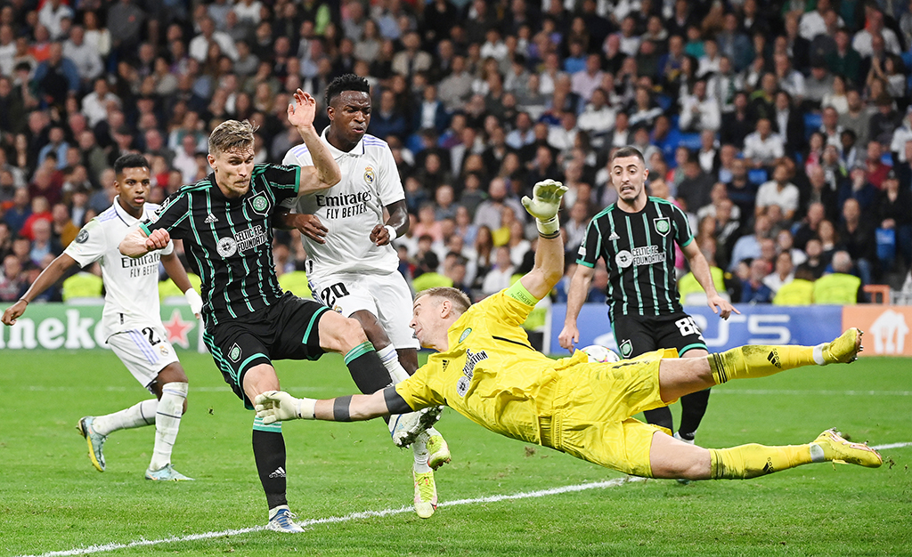 MADRID: Celtic's English goalkeeper Joe Hart (center) dives for the ball during the UEFA Champions League 1st round day 6 Group F football match between Real Madrid CF and Celtic FC on November 2, 2022. - AFP
