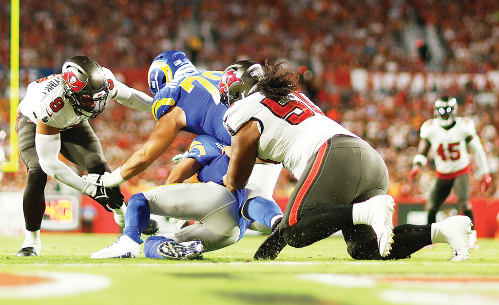 TAMPA: Matthew Stafford #9 of the Los Angeles Rams gets sacked by Vita Vea #50 of the Tampa Bay Buccaneers in the third quarter at Raymond James Stadium on November 06, 2022.- AFP