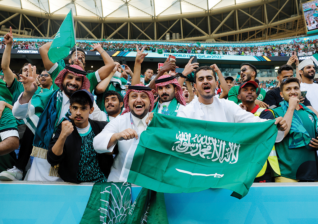 Supporters of Saudi Arabia celebrate their team's victory during the Qatar 2022 World Cup Group C football match between Argentina and Saudi Arabia.