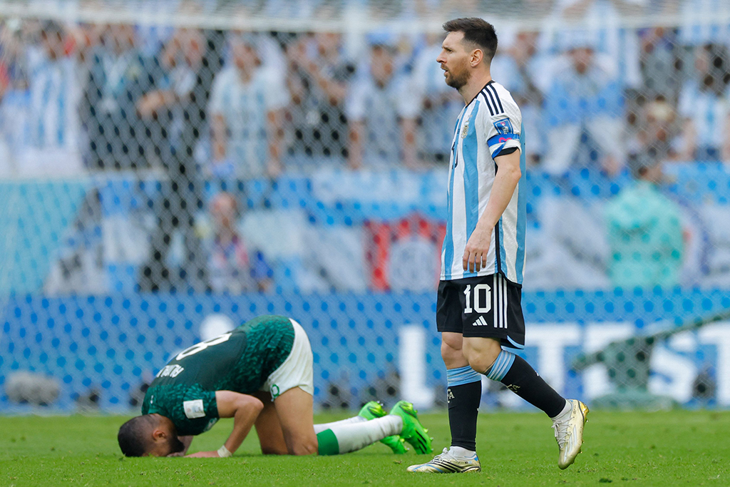 DOHA: Argentina's forward #10 Lionel Messi leaves the pitch as a Saudi player prostrates after the Qatar 2022 World Cup Group C football match between Argentina and Saudi Arabia at the Lusail Stadium on Nov 22, 2022. - AFP