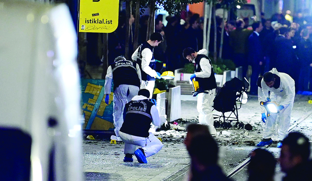 ISTANBUL: A forensic team of the crime scene investigation police work after a strong explosion shook the busy shopping street of Istiklal on Nov 13, 2022. – AFP
