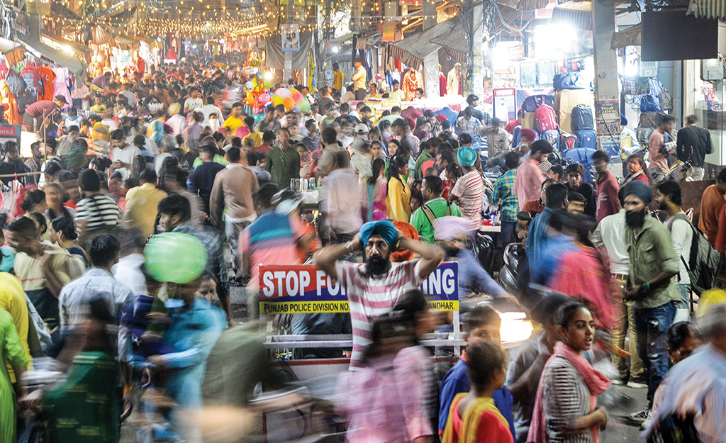JALANDHAR: This picture taken on Oct 23, 2022 shows people walking in a market. - AFP
