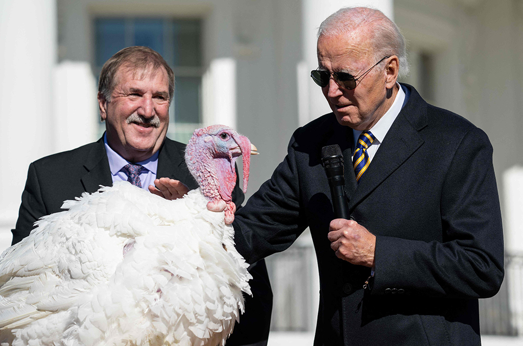 WASHINGTON: US President Joe Biden pardons Chocolate, the national Thanksgiving turkey, as he is joined by National Turkey Federation Chairman Ronnie Parker on the South Lawn of the White House on Nov 21, 2022.- AFP