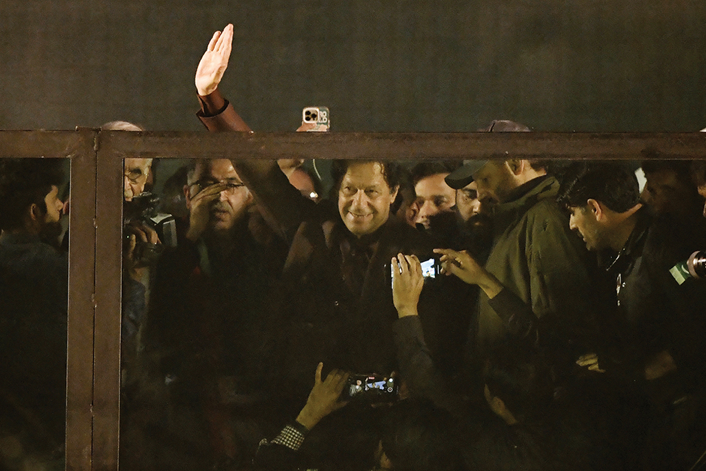 RAWALPINDI: Former Prime Minister Imran Khan waves at supporters as he arrives to lead an anti-government rally on Nov 26, 2022. – AFP