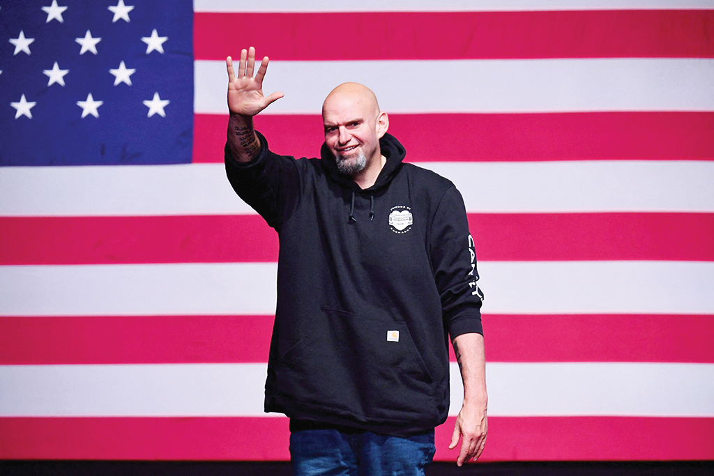 PITTSBURGH: Pennsylvania Democratic Senatorial candidate John Fetterman waves onstage at a watch party at Stage AE on Nov 8, 2022. – AFP