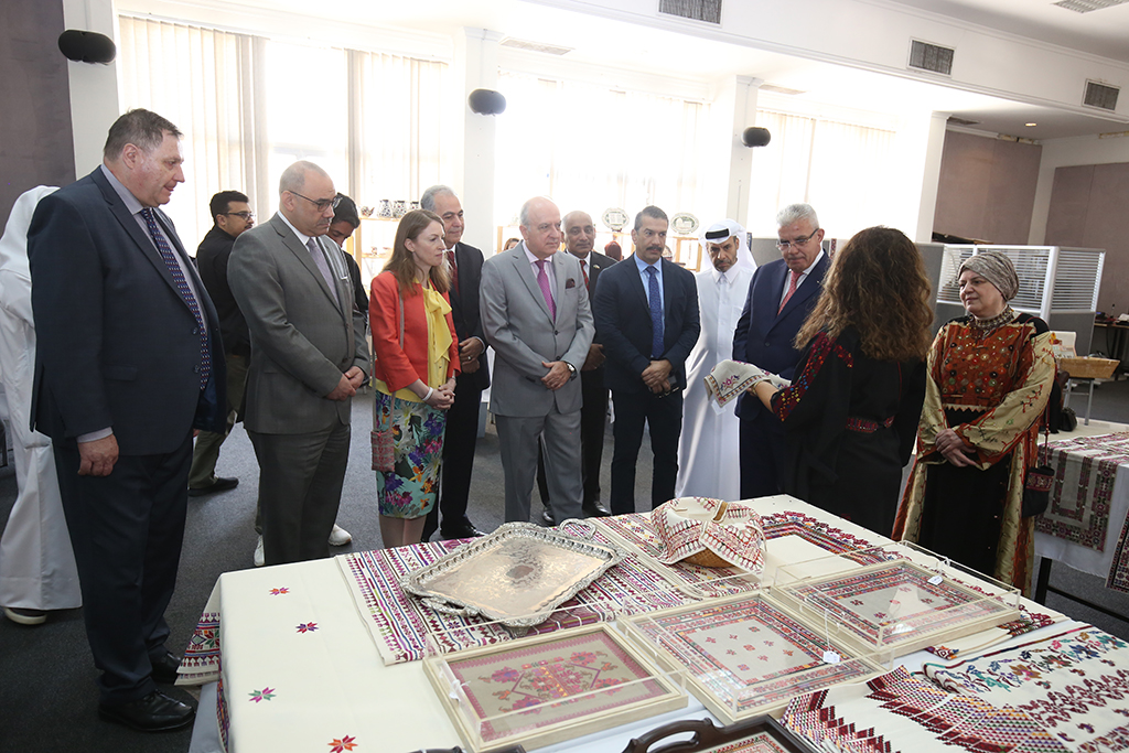 KUWAIT: Palestinian Ambassador to Kuwait Rami Tahboub checks out a textile product at Palestinian exhibition on Monday.— Photos by Yasser Al-Zayyat
