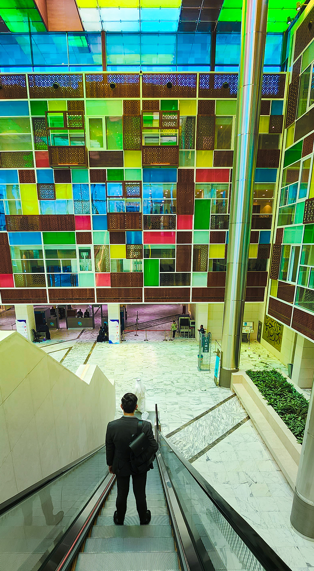 The use of colors inspired by Arabic Sadu on the walls inside the Ministries Complex.