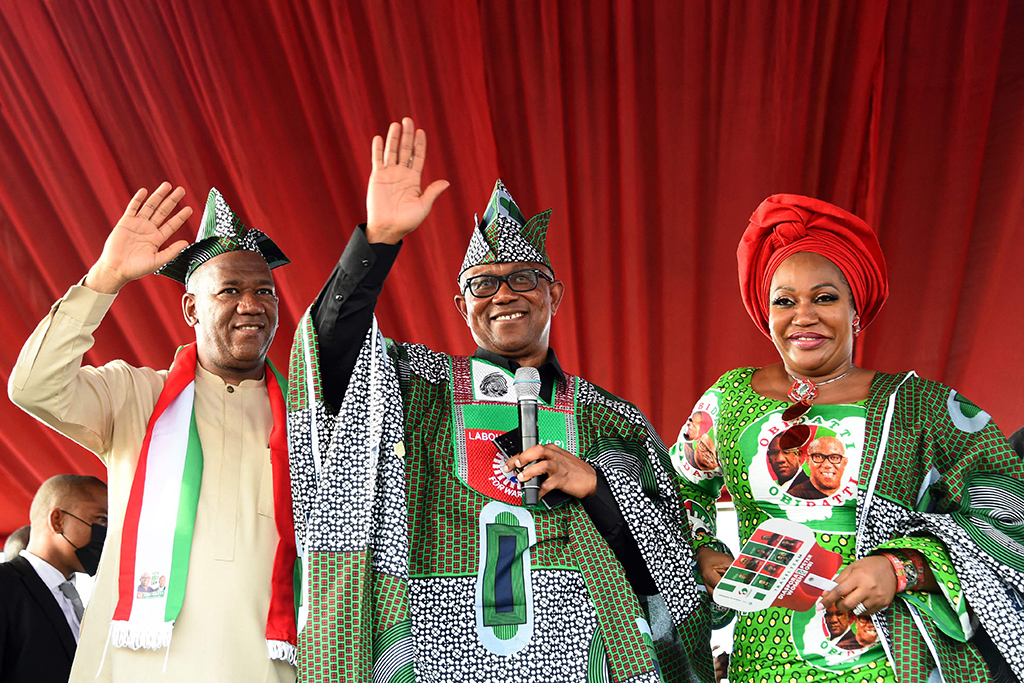 IBADAN: Labor Party’s Presidential candidate Peter Obi (center), flanked by wife Margaret and his running mate Yusuf Datti Baba-Ahmed, greets supporters during a campaign rally at Adamasingba Stadium in Ibadan, southwestern Nigeria.- AFP