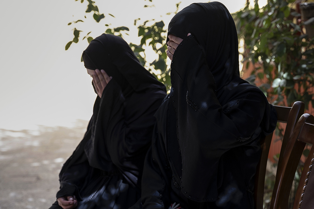 CHARIKAR, Afghanistan: In this photograph taken on October 15, 2022, Sarah (right), 20, sits next to her sister Fatima, 19, during an interview with AFP in Charikar, Parwan province.– AFP