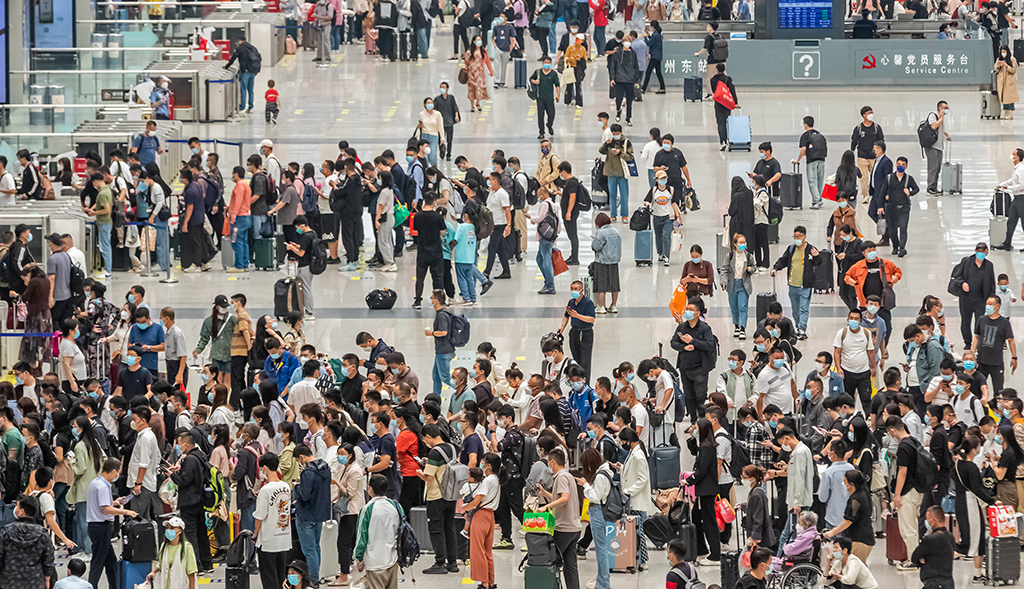 ZHENGZHOU: In this file photo, passengers crowd Zhengzhou East Railway Station in Zhengzhou in China’s central Henan province.- AFP