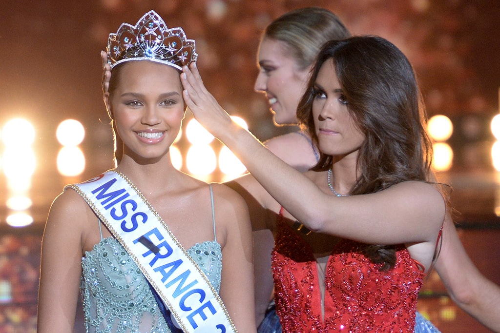 Newly elected Miss France Indira Ampiot (left) is crowned by Miss France 2022 Diane Leyre (center) during the Miss France 2023 beauty contest in Deols, central France.— AFP photos
