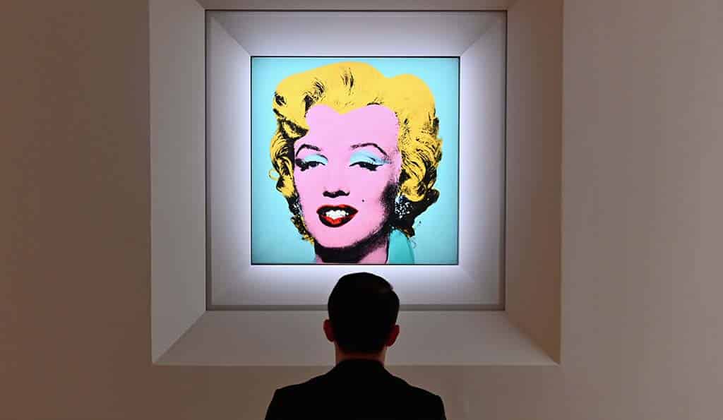 In this file photo a man looks at Andy Warhol’s ‘Shot Sage Blue Marilyn’ during Christie’s 20th and 21st Century Art press preview at Christie’s New York in New York City.— AFP