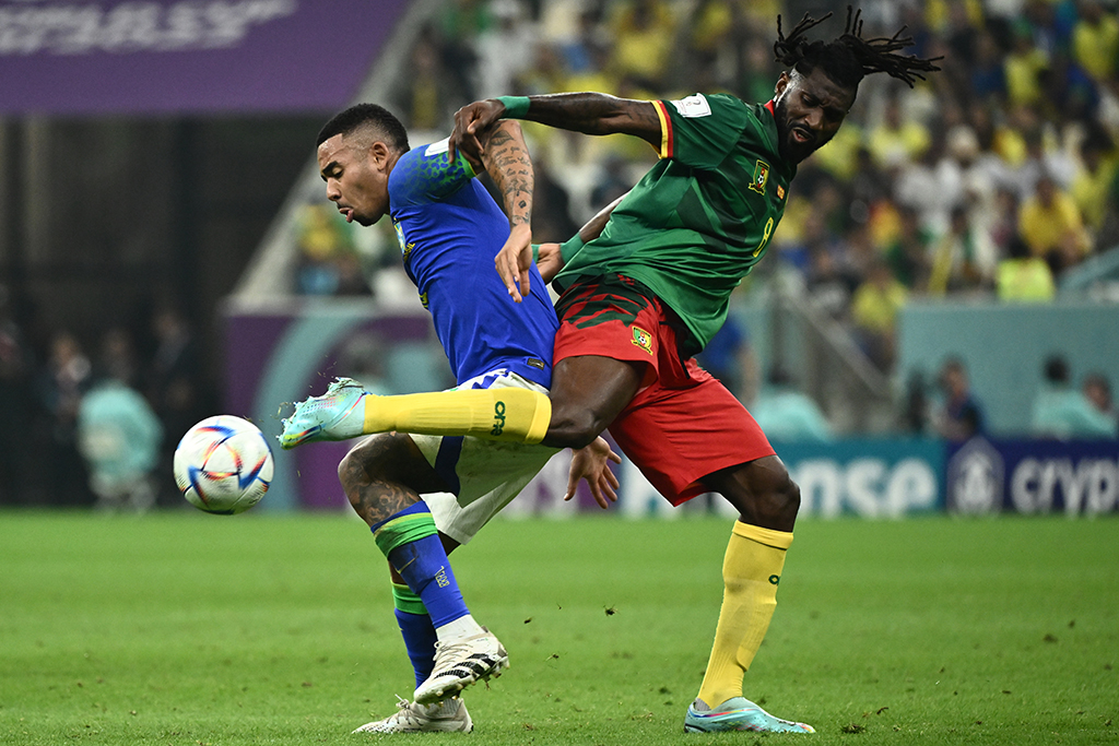 DOHA: Brazil's forward #18 Gabriel Jesus (L) fights for the ball with Cameroon's midfielder #08 Andre-Frank Zambo Anguissa (R) during the Qatar 2022 World Cup Group G football match between Cameroon and Brazil at the Lusail Stadium in Lusail, north of Doha. – AFP