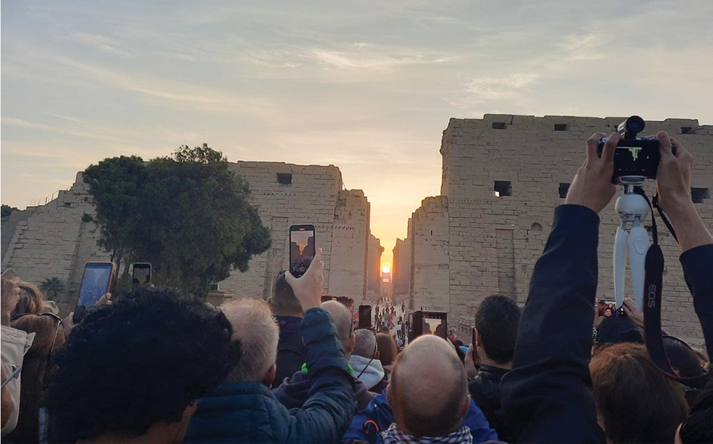 LUXOR: Egyptian and foreign tourists flock to the Karnak temples in Luxor to witness the phenomenon of sunrise on Wednesday.— KUNA