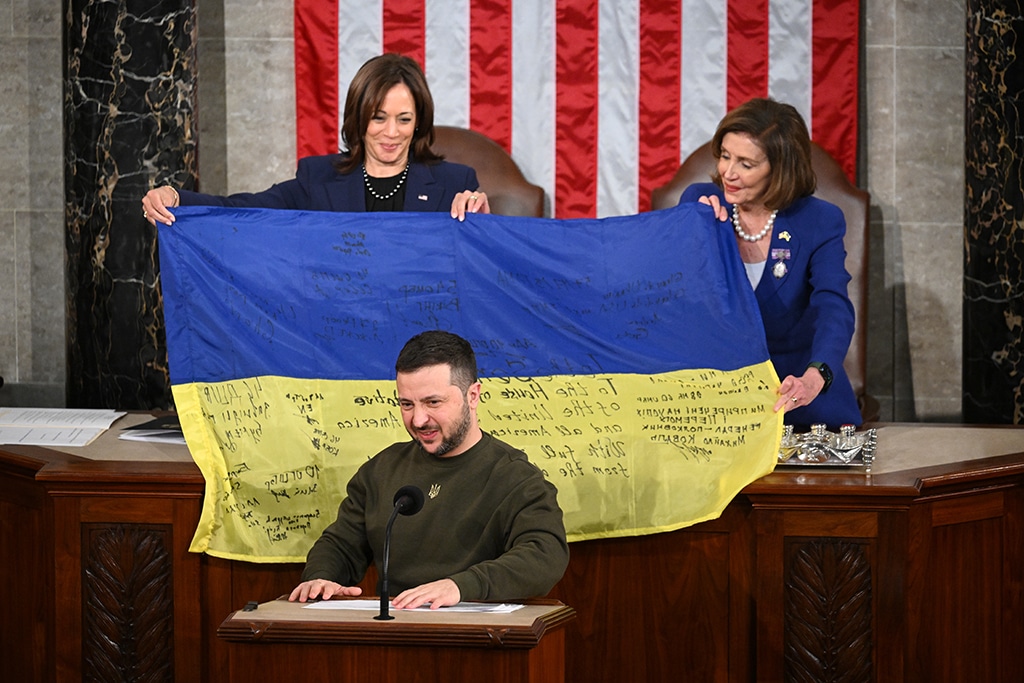 WASHINGTON: Ukraine's President Volodymyr Zelensky speaks after giving a Ukrainian national flag to US House Speaker Nancy Pelosi (D-CA) and US Vice President Kamala Harris (L) during his address the US Congress at the US Capitol in Washington. – AFP