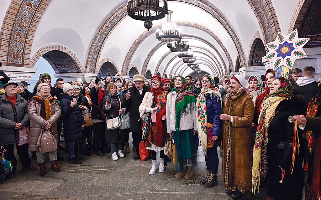 KYIV: Local residents, dressed in traditional costumes, sing Christmas carols inside a metro station in Kyiv, amid the Russian invasion of Ukraine. - AFP