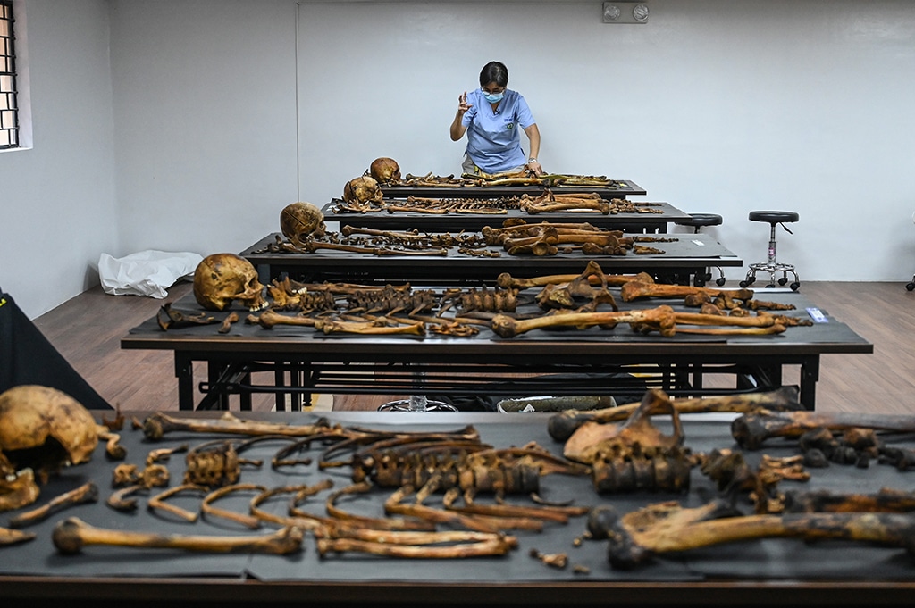 MANILA: Photo shows forensic pathologist Raquel Fortun arranging the skeletal remains of a drug war victim for autopsy in her laboratory at the University of the Philippines College of Medicine in Manila. - AFP