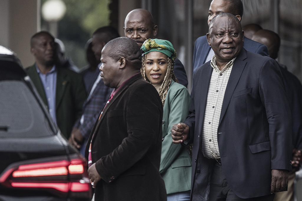 JOHANNESBURG, South Africa: South African President Cyril Ramaphosa (R) leaves the NASREC Centre in Johannesburg, on December 05, 2022 after a National Executive Committee (NEC) meeting of the Africa National Congress (ANC) to discuss the fate of the President. – AFP