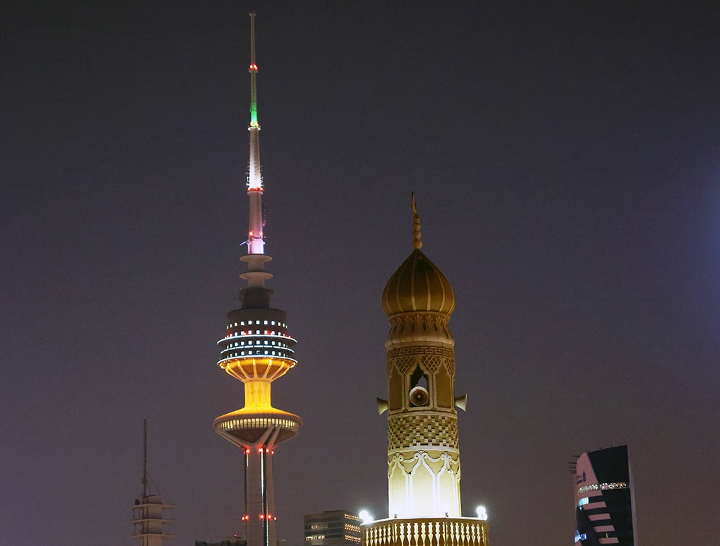 KUWAIT: The Liberation Tower, the 372-meter-high telecommunications tower and the minaret of a mosque are seen juxtaposed with each other in a telescopic shot in Kuwait. – Photo by Yasser Al-Zayyat