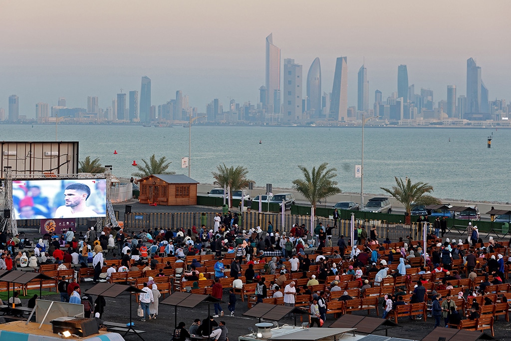Supporters watch the Qatar 2022 World Cup football final match between Argentina and France, at an outdoor venue along the Sheikh Jaber causeway in Kuwait City on December 18, 2022. (Photo by YASSER AL-ZAYYAT / AFP)