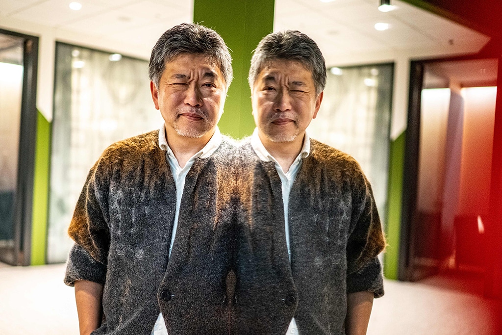 Japanese director Hirokazu Kore-eda poses during a photo session following an interview in Tokyo on Dec 9, 2022. – AFP
