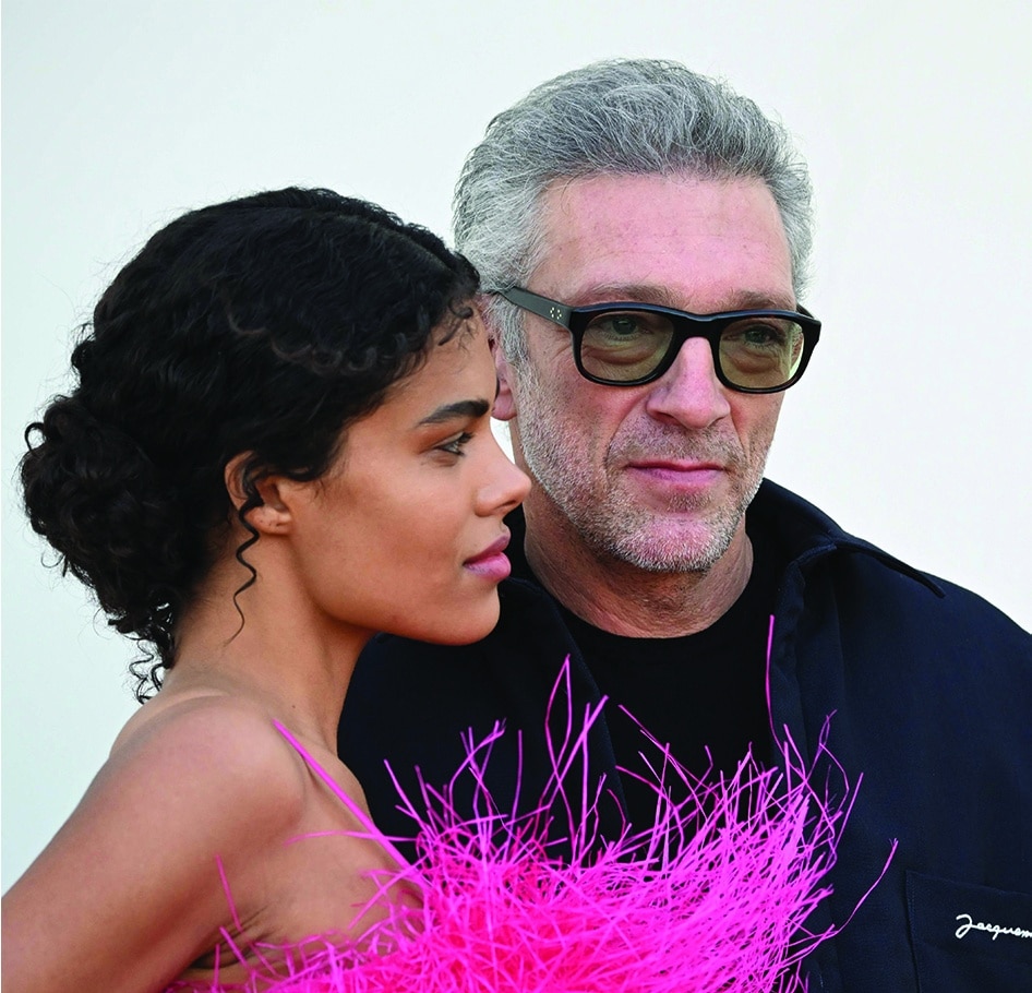 French actor Vincent Cassel and his wife French model Tina Kunakey arrive for the Jacquemus fashion show in the Paris suburb of Le Bourget on December 12, 2022.