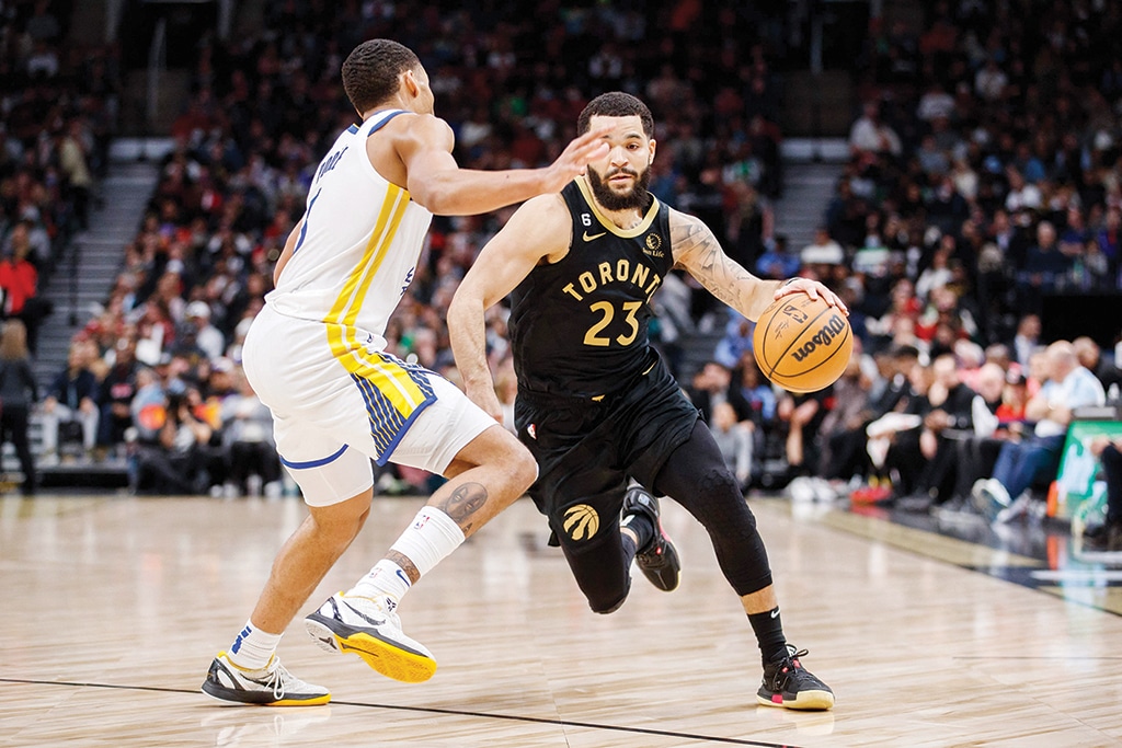 TORONTO: Fred VanVleet #23 of the Toronto Raptors drives to the net against Jordan Poole #3 of the Golden State Warriors during the second half of their NBA game at Scotiabank Arena on December 18, 2022.- AFP