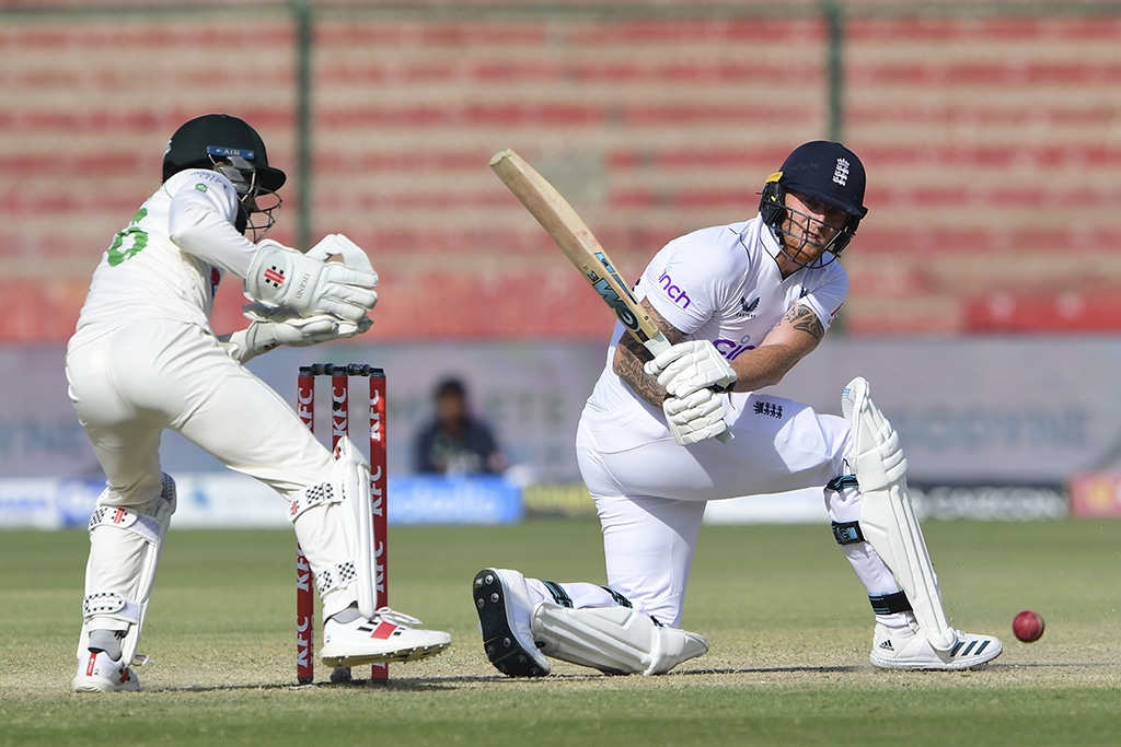 KARACHI: England's captain Ben Stokes (right) plays a shot during the fourth day of third Test match between Pakistan and England at the National Stadium in Karachi on December 20, 2022.- AFP