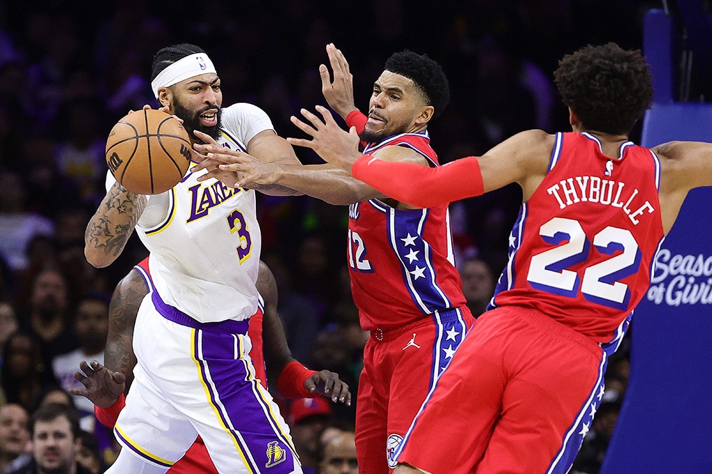 PHILADELPHIA: Anthony Davis #3 of the Los Angeles Lakers is guarded by Tobias Harris #12 of the Philadelphia 76ers during the third quarter at Wells Fargo Center on December 09, 2022.- AFP