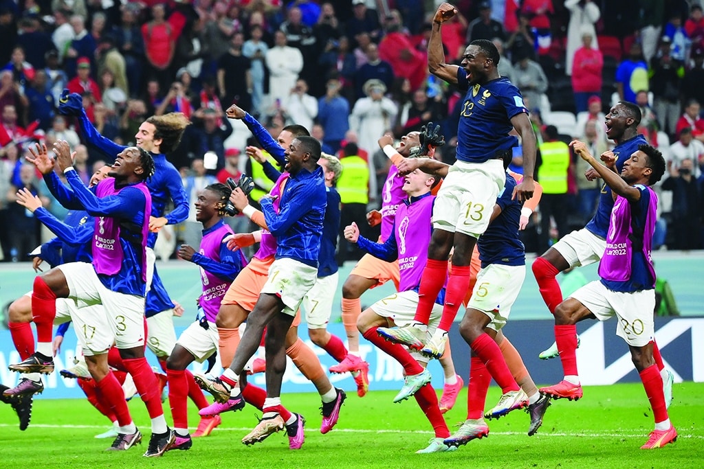 DOHA: France's players celebrate their victory in the Qatar 2022 World Cup semi-final football match between France and Morocco at the Al-Bayt Stadium in Al Khor, north of Doha on December 14, 2022. - AFP photos
